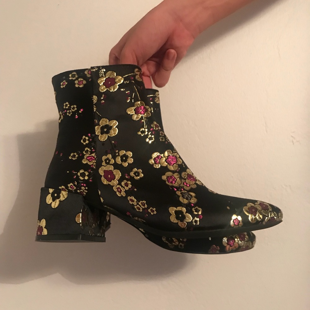 Black ankle boots with flower design